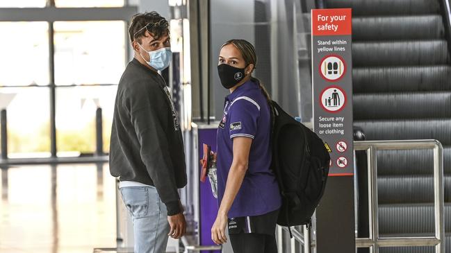 Richmond player Sydney Stack farewells his girlfriend Mikayla Morrison. Pic. Iain Gillespie/The West Australian.