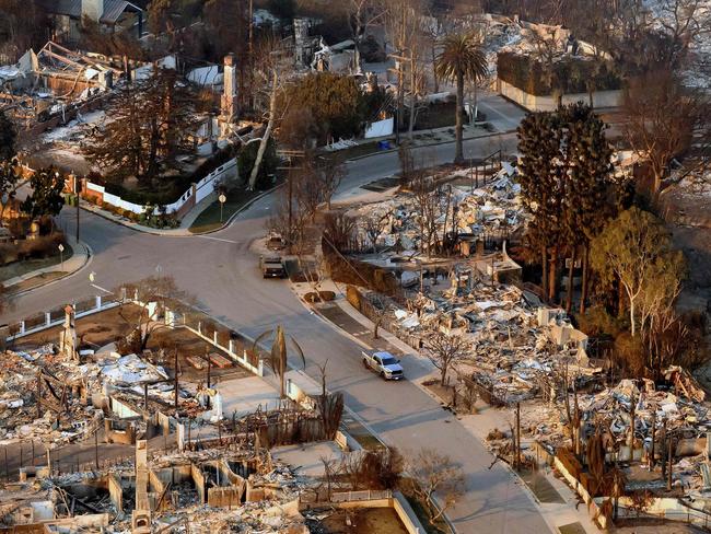 In this aerial view taken from a helicopter, burned homes are seen from above during the Palisades fire in the Pacific Palisades neighbourhood of Los Angeles. Picture: JOSH EDELSON / AFP