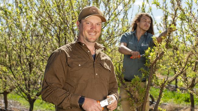 Victorian grower Mitchell McNab with worker Matthew Fry from Cairns. Picture: Zoe Phillips