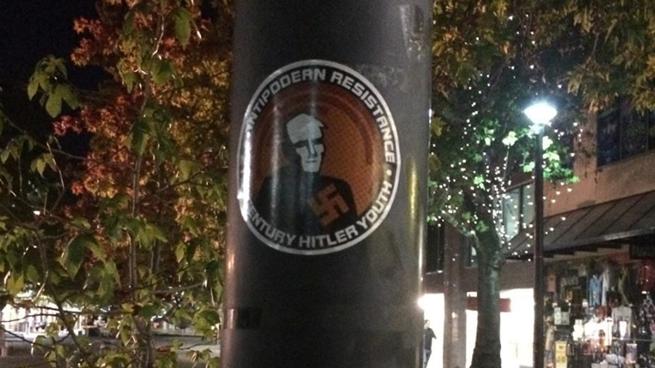 Stickers promoting the hate group have been posted all over Canberra.