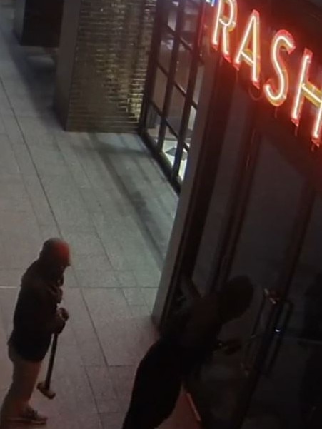 Two suspects, including one armed with a sledgehammer, moments before breaking into Rashays restaurant just before dawn on February 27. Picture: supplied