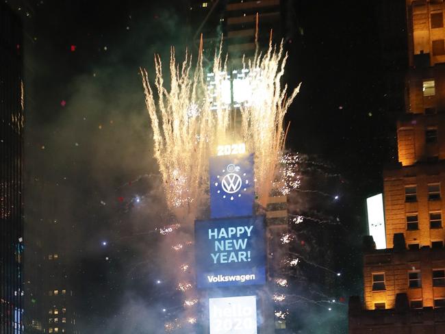 Confetti drops over the crowd as the clock strikes midnight during the New Year's celebration as seen from the New York Marriott Marquis in New York's Times Square, early Wednesday, Jan. 1, 2020. (AP Photo/Frank Franklin II)