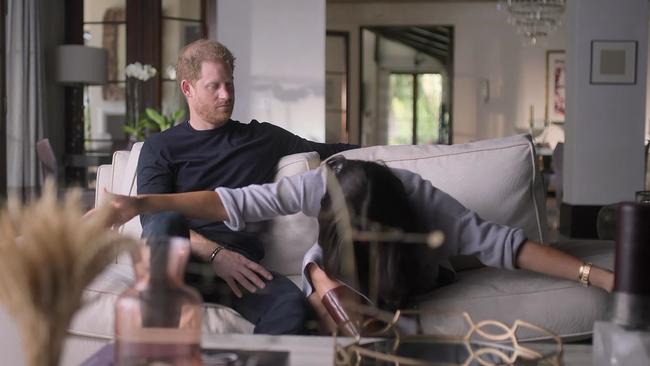 Meghan demonstrates her first curtsy to the Queen. Picture: Netflix