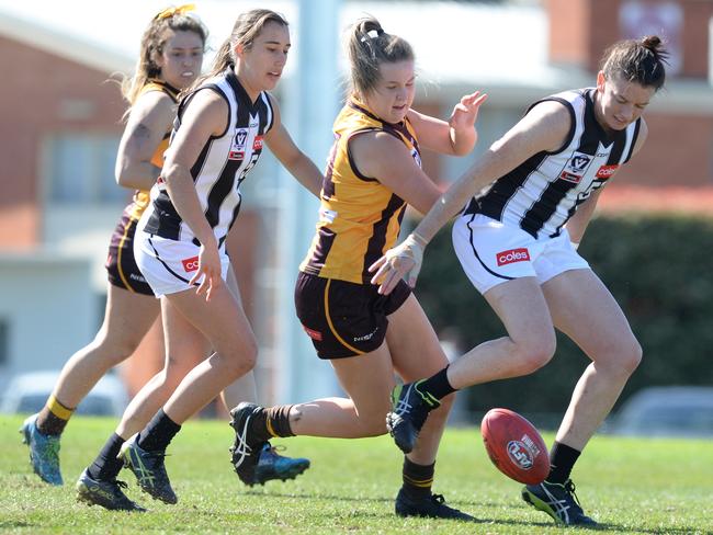 VFL Womens football: Hawthorn v Collingwood at Box Hill city oval. Hawthorn player #14 Olivia Flanagan battles for possession with Collingwood #57 Stacey Lawrey. (R)Picture:AAP/ Chris Eastman