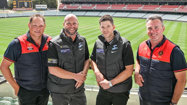 South Australia’s 2004-25 coaches, from left, Ryan Harris (men’s coach), Luke Williams (Strikers WBBL), Tim Paine (Strikers BBL) and Mick Delaney (women’s) at Adelaide Oval. Picture: Brenton Edwards