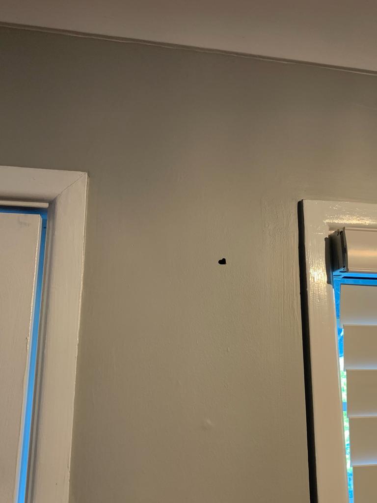 A bullet hole inside the house.