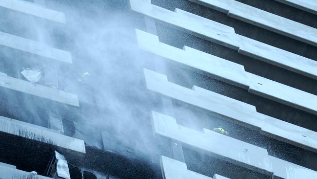 The smoking tower on Monday morning. Picture: Andrew Henshaw