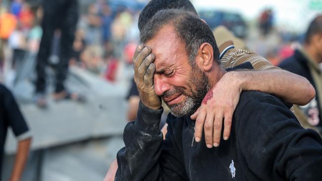 A man cries because his home was bombed during Israeli raids in the southern Gaza Strip on October 16, 2023 in Khan Yunis, Gaza. Picture: Ahmad Hasaballah/Getty Images