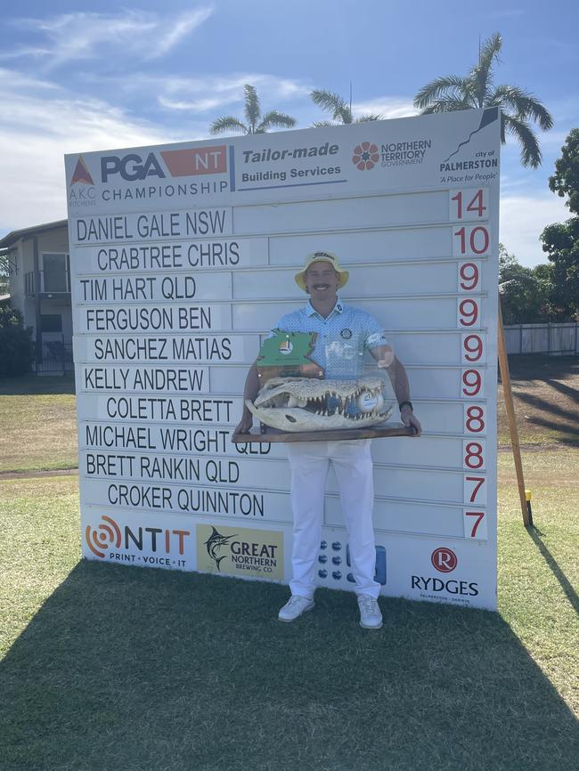 NT PGA Championship winner Daniel Gale in front of the final scoreboard. Picture: Max Hatzoglou