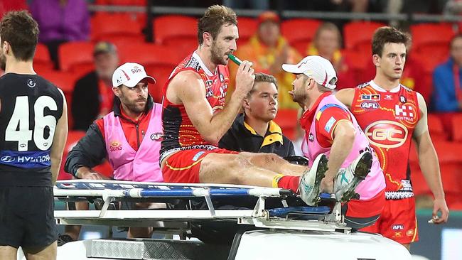 Michael Barlow is stretchered from the field during the last quarter of Gold Coast’s loss. Picture: Getty