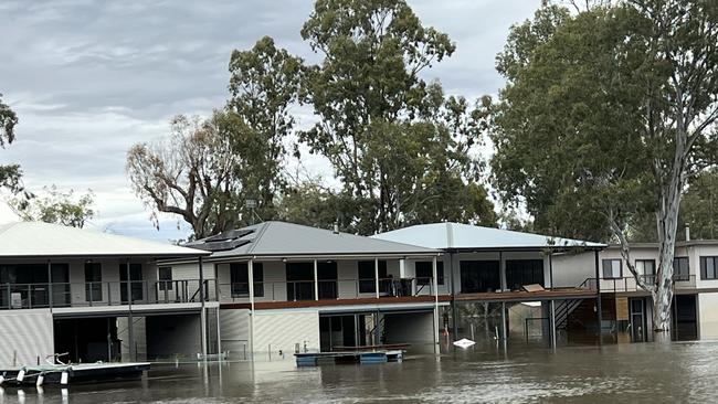 Water lapping at shacks. Picture: James Juers