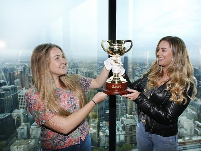 Erin Hayes and Orla Corrigan with the Melbourne Cup on the Eureka Skydeck. Picture: David Caird