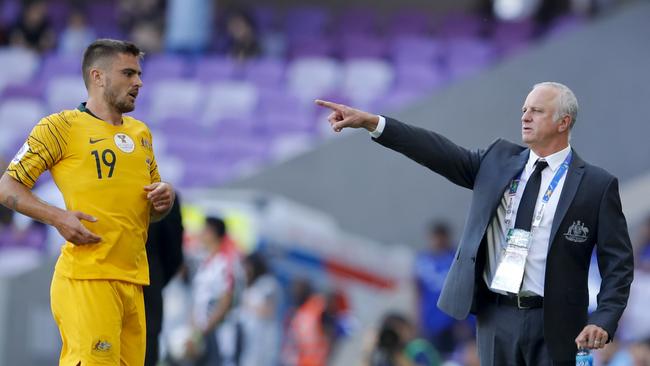 Australia's head coach Graham Arnold, right, gives instructions from the sideline against Jordan. Picture: AP