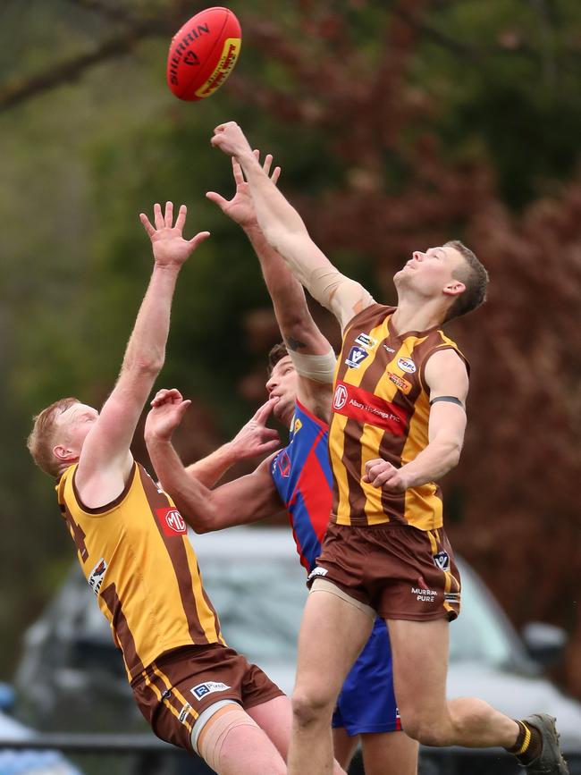 Kiewa-Sandy Creek pair Mason Brown, left and Nic Carne outnumber Beechworth’s Lachlan Armstrong.