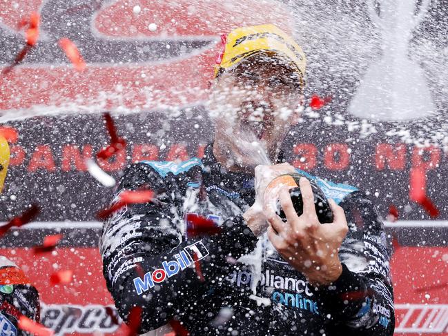 DAILY TELEGRAPH. DECEMBER 5, 2021.Pictured is Chaz Mostert celebrating on the podium after winning the Repco Bathurst 1000 at Mount Panorama today. Picture: Tim Hunter.