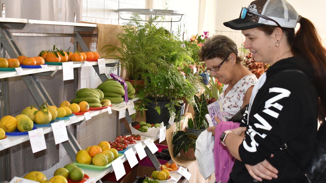 Show Whitsunday attendees admiring prizewinning produce in the Daly Thomas pavilion. Picture: Kirra Grimes