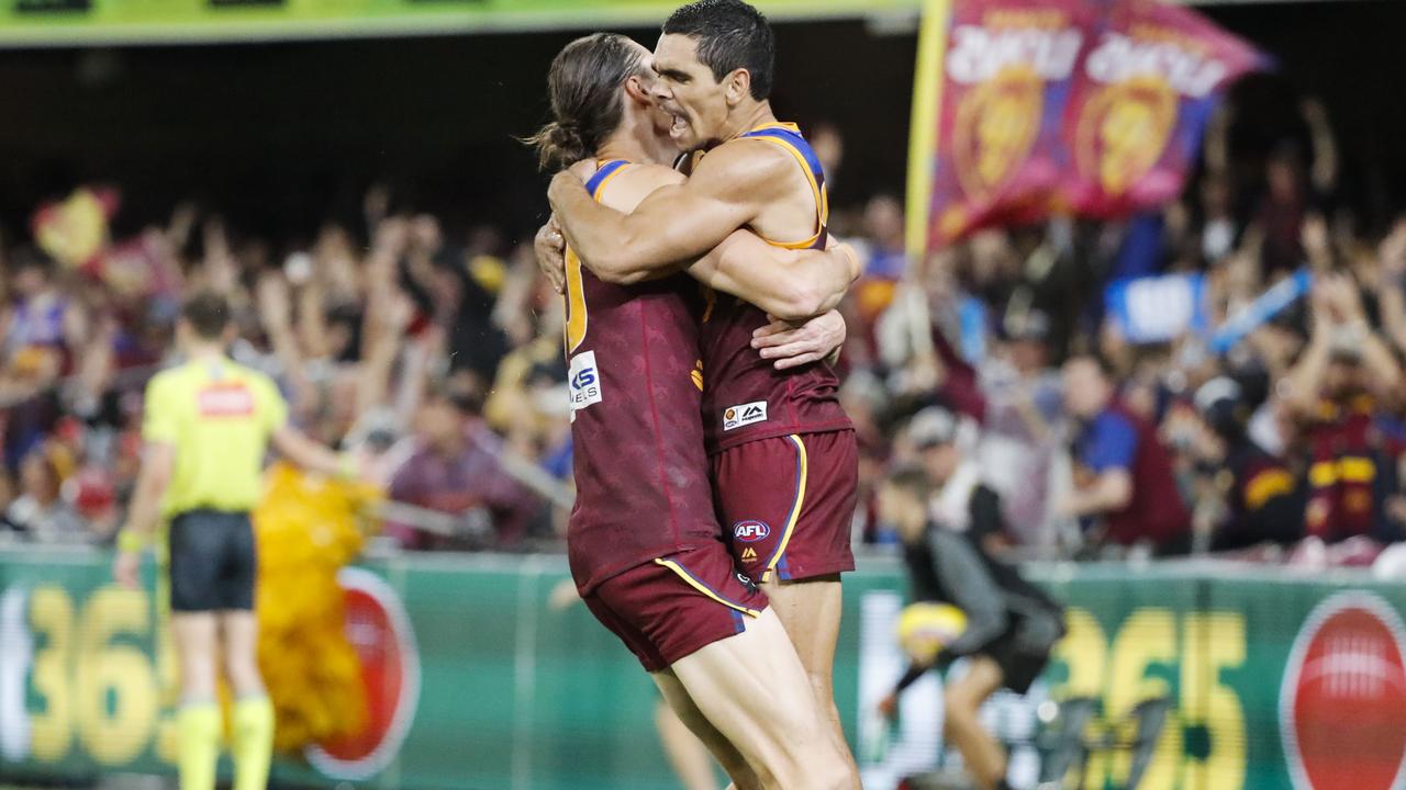 Charlie Cameron and Eric Hipwood celebrate a goal for the Lions. Picture: AAP Images 