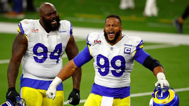 Aaron Donald of the Los Angeles Rams reacts after sacking Joe Burrow. Photo by Ronald Martinez/Getty Images.