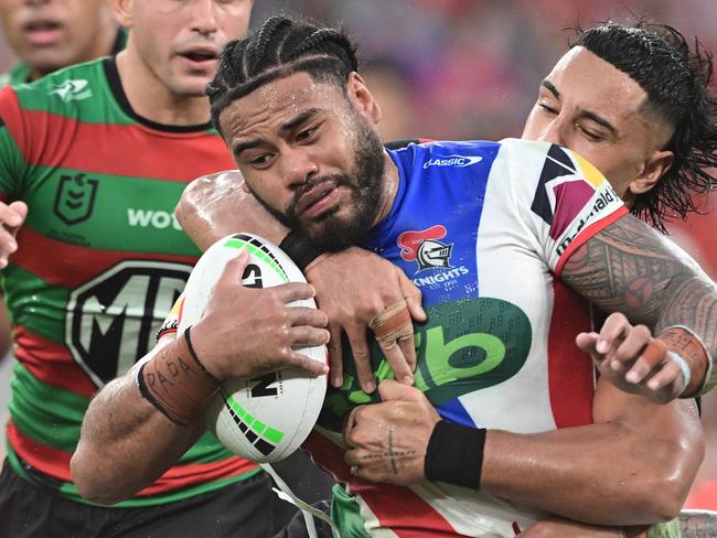 BRISBANE, AUSTRALIA - MAY 03: Greg Marzhew of the Knights is tackled during the round nine NRL match between the South Sydney Rabbitohs and Newcastle Knights at Suncorp Stadium on May 03, 2025, in Brisbane, Australia. (Photo by Bradley Kanaris/Getty Images)
