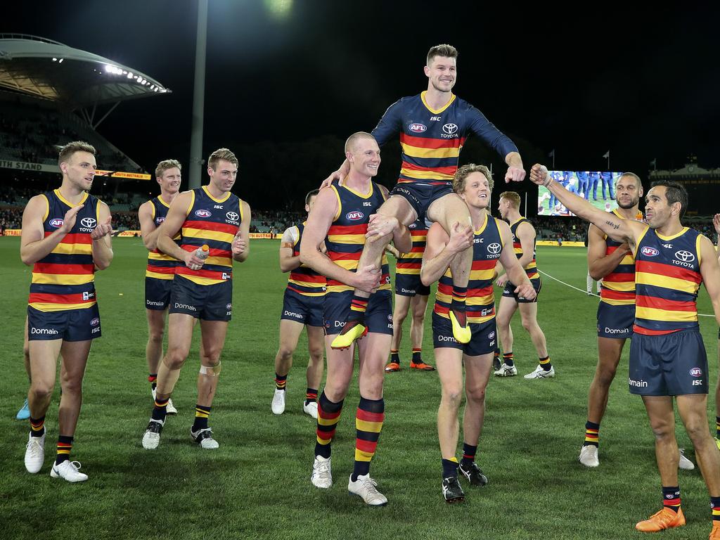 Bryce Gibbs gets chaired off in his 250th game by Sam Jacobs and Rory Sloane. Picture SARAH REED