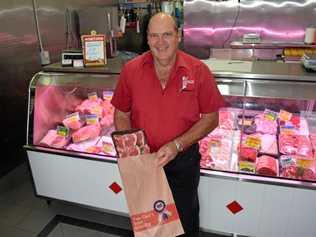 NO CHARGE: Ross Bell of Bell Butchers gives out paper bags for free in the wake of the plastic bag ban. Picture: Elyse Wurm