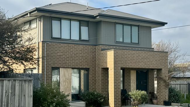 A Norlane home can be seen with a boarded up front window. Photo: Alan Barber.