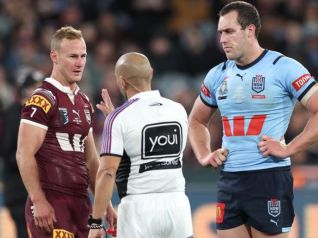 MELBOURNE, AUSTRALIA - JUNE 26:  Referee Ashley Klein talks to Daly Cherry-Evans of the Maroons and Isaah Yeo of the Blues during game two of the men's State of Origin series between New South Wales Blues and Queensland Maroons at the Melbourne Cricket Ground on June 26, 2024 in Melbourne, Australia. (Photo by Cameron Spencer/Getty Images)