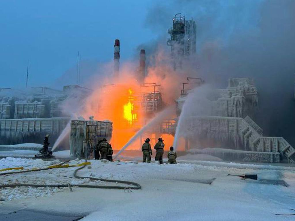 Rescuers working to extinguish a fire at a natural gas terminal in the Russian Baltic Sea port of Ust-Luga west of Saint Petersburg near the Estonian border. Picture: AFP