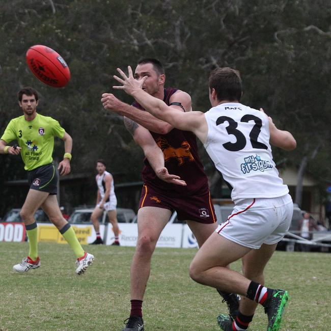 Nathan Colenso moves to hustle Palm Beach Currumbin player Jesse Derrick. Pic Mike Batterham