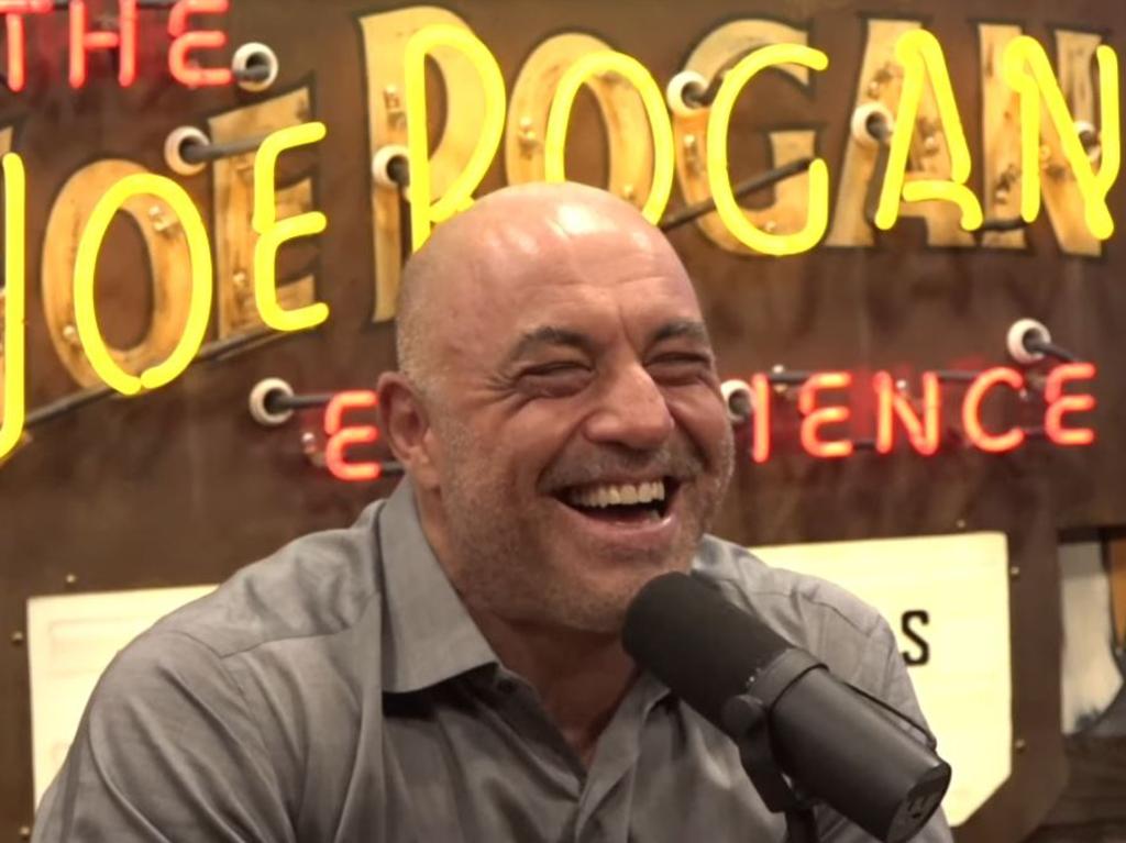 Rogan appears amused during the podcast recording.