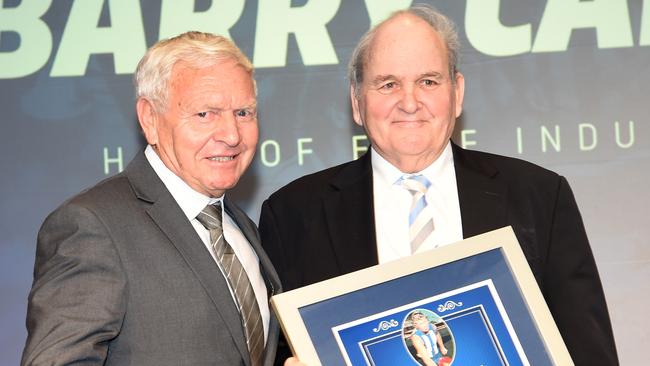 Ron Joseph, right, presents Barry Cable into the North Melbourne Hall of Fame. Picture: Tony Gough