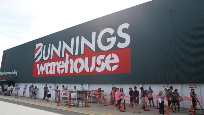 Shoppers queue outside Bunnings in Myaree in Perth. Picture: Getty Images