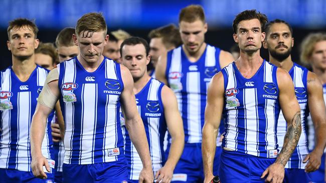 MELBOURNE, AUSTRALIA - APRIL 02: Jack Ziebell and his Kangaroos team mates look dejected after losing the round 3 AFL match between the North Melbourne Kangaroos and the Western Bulldogs at Marvel Stadium on April 02, 2021 in Melbourne, Australia. (Photo by Quinn Rooney/Getty Images)