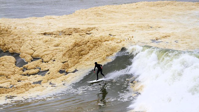 Foam's up as surfers brave massive murky-brown waves | news.com.au — Australia's leading news site