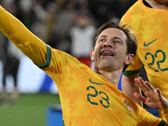 Australia's Craig Goodwin celebrates scoring a goal during the FIFA World Cup 2026 Asia zone qualifiers football match between Australia and China in Adelaide on October 10, 2024. (Photo by Brenton Edwards / AFP) / -- IMAGE RESTRICTED TO EDITORIAL USE - STRICTLY NO COMMERCIAL USE --