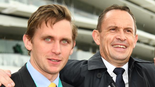 Charlie Duckworth and trainer Chris Waller pose with jockey James McDonald after he rode Nature Strip to victory in race 5, the Darley Sprint Classic, during Seppelt Wines Stakes Day at Flemington Racecourse in Melbourne, Saturday, November 9, 2019. (AAP Image/Vince Caligiuri) NO ARCHIVING, EDITORIAL USE ONLY