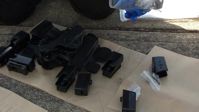 Police have seized almost a dozen firearms, more than $400,000 cash, and $1 million worth of designer goods, before charging three men over their alleged roles in a sophisticated cocaine syndicate.