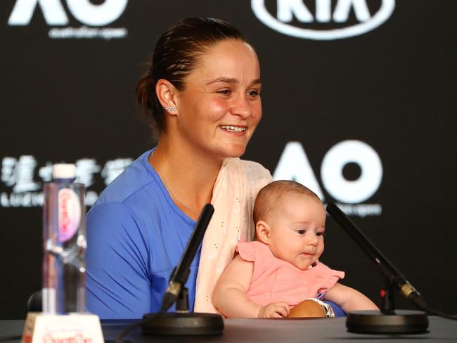 Barty holds niece Olivia at her post-match media conference. Picture: Getty