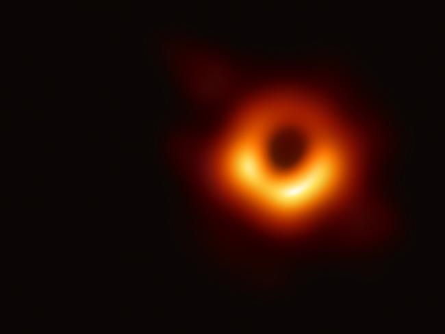 TOPSHOT - A handout photo provided by the European Southern Observatory on April 10, 2019 shows the first photograph of a black hole and its fiery halo, released by Event Horizon Telescope astronomers (EHT), which is the "most direct proof of their existence," one of the project's lead scientists told AFP. (Photo by - / EUROPEAN SOUTHERN OBSERVATORY / AFP) / RESTRICTED TO EDITORIAL USE - MANDATORY CREDIT "AFP PHOTO / EUROPEAN SOUTHERN OBSERVATORY" - NO MARKETING NO ADVERTISING CAMPAIGNS - DISTRIBUTED AS A SERVICE TO CLIENTS