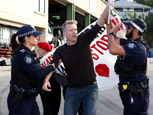 Anti-Adani protester Ben Pennings blocks Meales Concrete Pumping driveway at Windsor. Picture: Adam Head