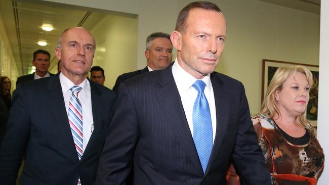 A stunned looking Tony Abbott leaves the Party room after losing the leadership ballot at Parliament House in Canberra. Picture: Ray Strange