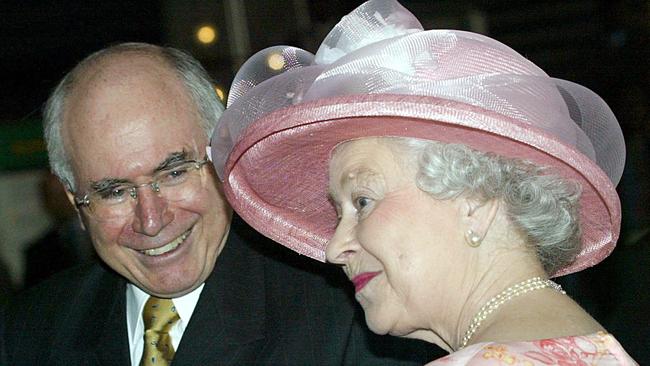 Queen Elizabeth II chats with then Prime Minister John Howard before the opening of the Commonwealth summit at the International Conference Centre in Abujain 2003. Picture: AFP