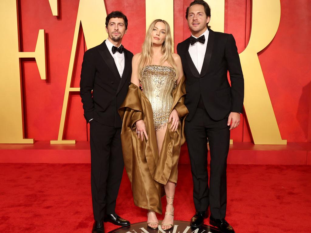 Margot Robbie with LuckyChap co-founders Josey McNamara and her husband Tom Ackerley. Picture: Getty Images via AFP