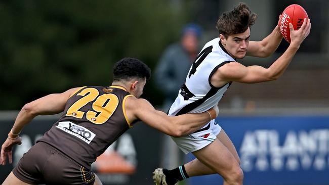 Thomastown’s Macca Zakkour tries to stop Josh Carelli of St Mary's. Picture: Andy Brownbill