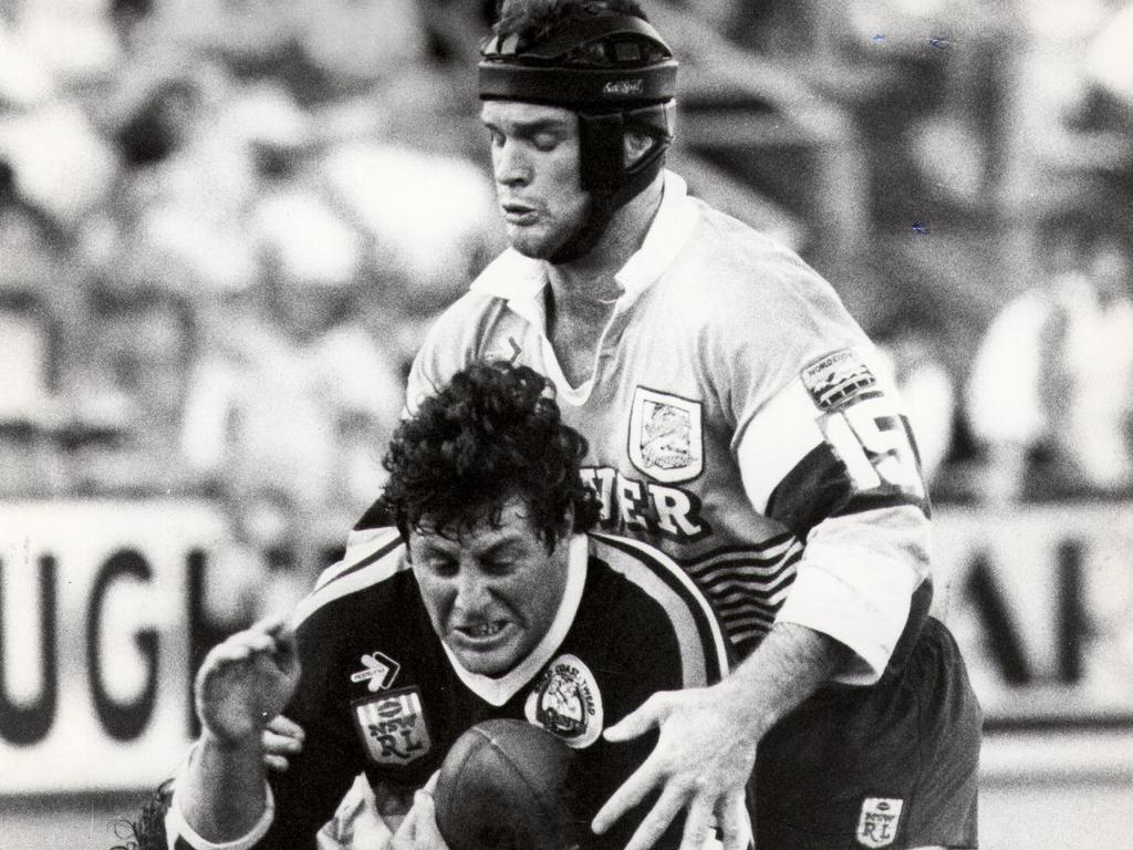 Gold Coast Tweed Giants vs Broncos in 1988. Chris Close is tackled by Greg Conescu as Keith Gee goes over the top at Seagulls Stadium.