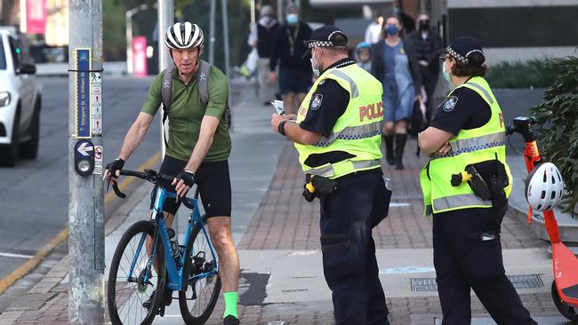 Police perform compliance checks during a snap three-day lockdown in Brisbane. Picture: NCA NewsWire / Jono Searle