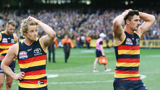 Rory Sloane and Taylor Walker after the 2017 grand final loss. Picture: Michael Dodge/AFL Media/Getty Images