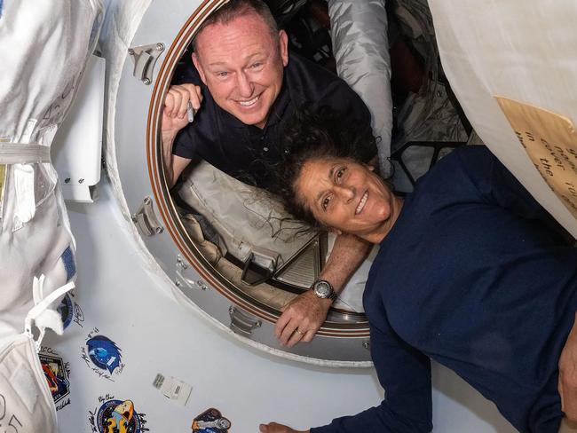 This undated handout picture from Nasa released on July2, 2024 shows NASAâs Boeing Crew Flight Test astronauts (from top) Butch Wilmore and Suni Williams inside the vestibule between the forward port on the International Space Stationâs Harmony module and Boeing's Starliner spacecraft. The first astronauts to fly Boeing's troubled Starliner are definitely not "stranded" at the International Space Station, NASA insisted on June 28, 2024 despite having no clear timeframe for bringing them home. In an unusually defensive press call, officials attempted to put a positive spin on where things currently stood after weeks of negative headlines due to the spaceship's delayed return. (Photo by Handout / NASA / AFP) / RESTRICTED TO EDITORIAL USE - MANDATORY CREDIT "AFP PHOTO / NASA" - NO MARKETING NO ADVERTISING CAMPAIGNS - DISTRIBUTED AS A SERVICE TO CLIENTS