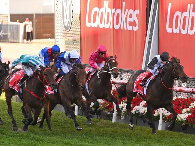 MELBOURNE, AUSTRALIA - OCTOBER 28: James McDonald riding Romantic Warrior (L) defeats Craig Williams riding Mr Brightside (r) and Tim Clark riding Alligator Blood in Race 9, the Ladbrokes Cox Plate, during Melbourne Racing at Moonee Valley Racecourse on October 28, 2023 in Melbourne, Australia. (Photo by Vince Caligiuri/Getty Images)