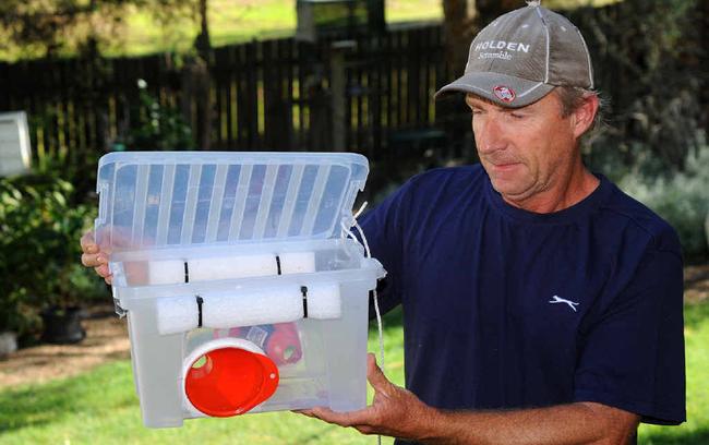 ARMED AND READY: Bevan Pugh with one of the traps that will in the battle to hold back the cane toad. Photo: Leigh Jensen